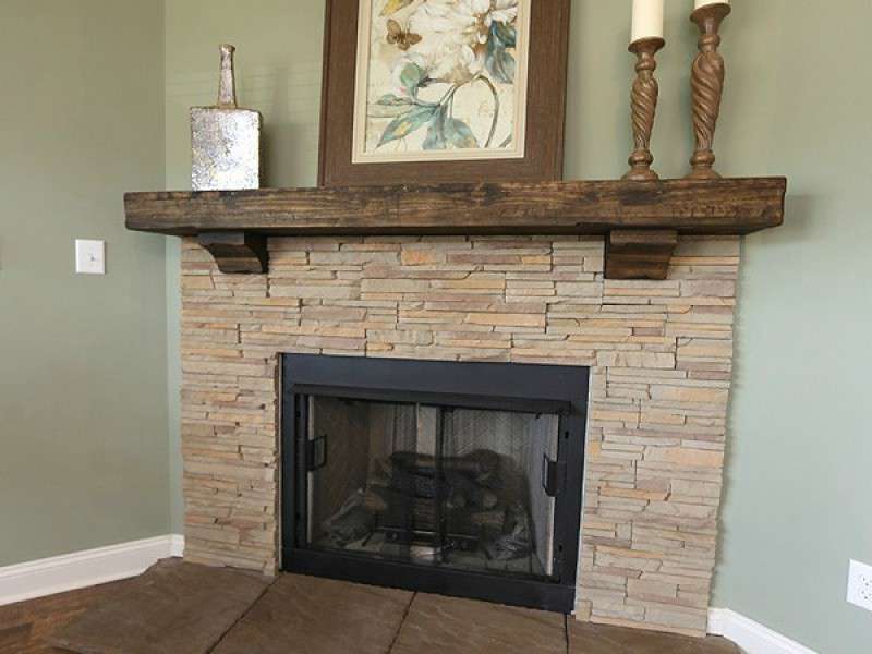 Gas Fireplace with Stone Surround and Wood Mantel